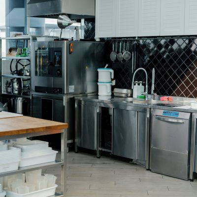 Professional commercial empty clean modern kitchen in restaurant cafe Metal kitchen equipment utensils